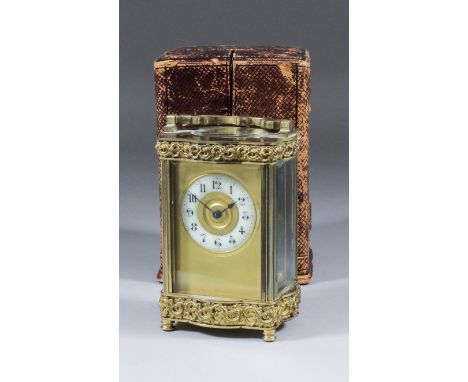 An early 20th Century French polished brass carriage timepiece, the 2ins diameter cream enamel dial with Arabic numerals to t
