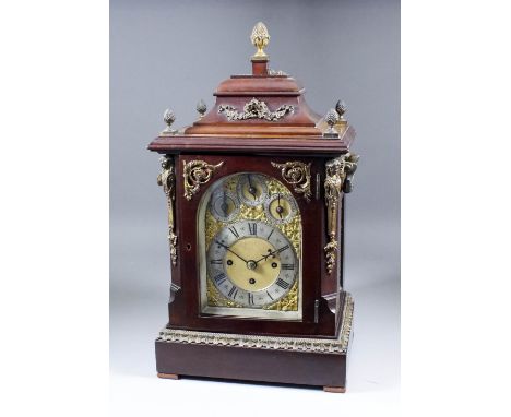 A late 19th Century mahogany and gilt brass mounted mantel clock of "18th Century" design, the 5ins arched brass dial with si