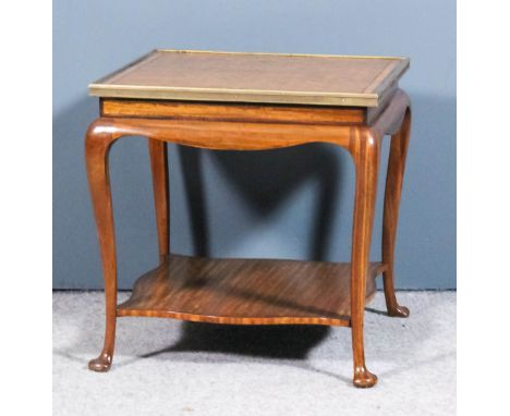 An Edwardian satinwood and gilt brass mounted square lamp table, the top inlaid with a trellis design, on slender cabriole le