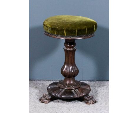 An early Victorian rosewood circular adjustable piano stool, the seat upholstered in green cloth, on turned and reeded centra