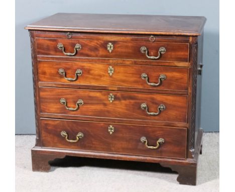 A George III mahogany chest with moulded edge to top, fitted slide and four long graduated drawers, with blind fret carved ca