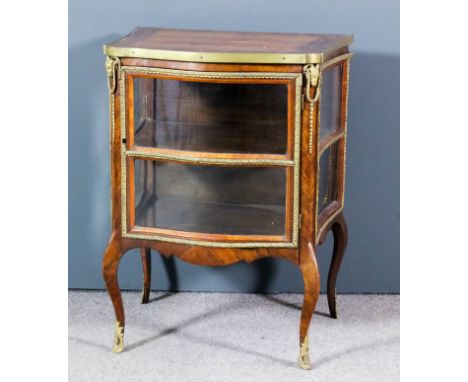 A 19th Century French rosewood, marquetry and gilt metal mounted vitrine of "Louis XV" design, the whole of shaped outline, t