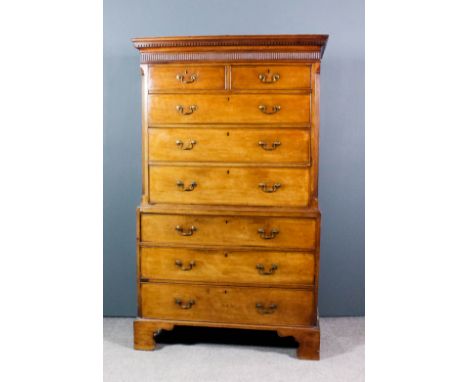 A George III mahogany tallboy, the upper part with dentil moulded cornice and fluted frieze, fluted canted corners, fitted tw