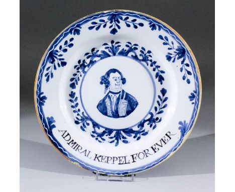 A late 18th Century London Delft blue and white plate - "Admiral Keppel Forever", the centre painted with a shoulder-length p