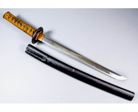 A Japanese Edo period (late 18th/early 19th Century) Wakizshasi, the 14ins bright steel blade displaying a visible hamon, the