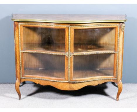 A 19th Century French rosewood, marquetry and gilt brass mounted dwarf vitrine of "Louis XV" design, the whole of bold shaped