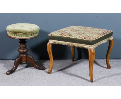 A Victorian walnut circular adjustable piano stool, the seat upholstered in green velour, on turned and leaf carved bulbous c