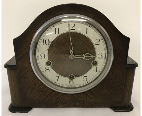 A vintage dark wood cased, Smiths mantle clock with Westminster chime. Complete with key and pendulum. Approx. 23cm tall x 28