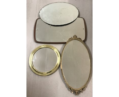 A collection of 4 vintage mirrors. Comprising: 2 oval mirrors, one with a bevelled edge &amp; intricately carved frame; a rou