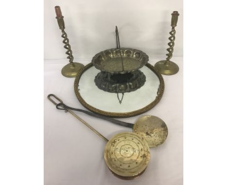 A collection of assorted vintage metal ware items. To include: brass twist candlesticks, vintage copper and brass nut roaster