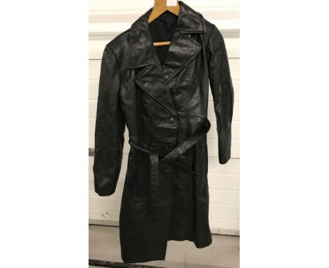 A vintage ladies full length black leather trench coat, belted with front button fastening. By "Leather Leder". Size 12.