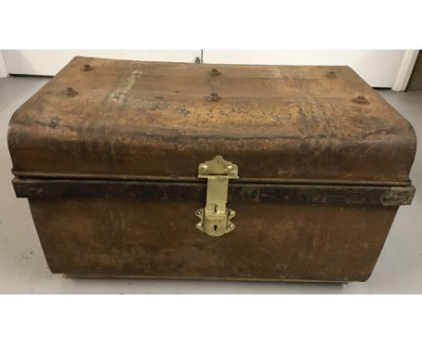 A Victorian 2 handled tin trunk with studded top and brass catch and lock.  Approx. 35cm tall x 59cm wide.