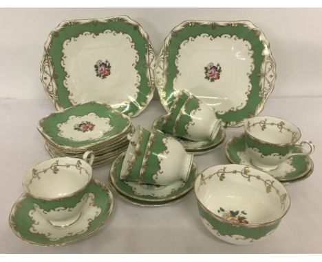 A vintage Fenton bone china part tea set with green and gilt detail. Comprising: 2 square shaped sandwich plates, 9 tea plate