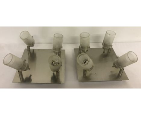 A pair of modern square shaped chrome ceiling lights. Each with 4 adjustable glass light shades. 