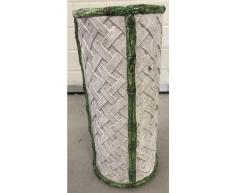 A majolica style weave design ceramic umbrella stand. In white and green glaze finish a/f. Total height 47cm.