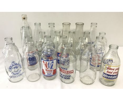 A box of 24 vintage advertising milk bottles. To include: Weetabix, Macleans toothpaste, LBC Radio and Typhoo. Lot includes w