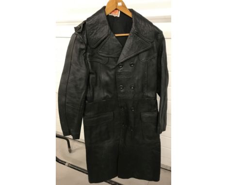 A vintage "Harrison &amp; Peters Ltd" full  length vintage men's black leather trench coat.  Size 40.