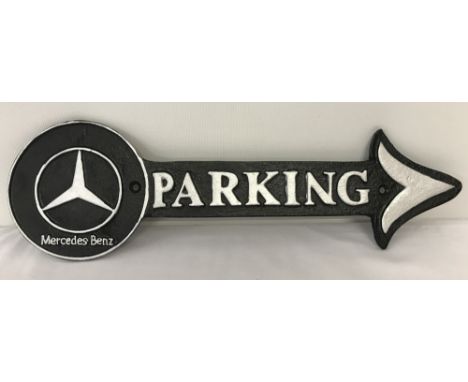 A wall hanging cast iron Mercedes Benz Parking arrow. In black and silver, with screw fixing holes. Approx. 40.5cm long.