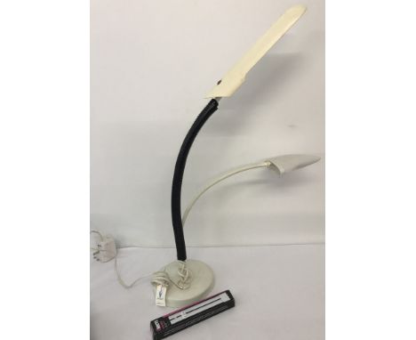 A large Daylight watchmaking/jewellery lamp. With integral magnifier. Together with E1840EB bulb. Approx. H58cm.