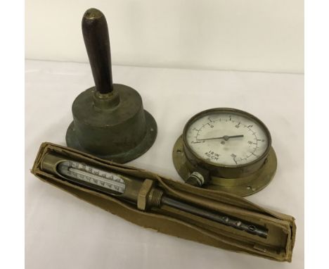 3 vintage brass items. An unusual brass bell together with 2 gauges. A boxed temperature gauge and a pressure gauge. 