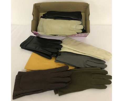 A box of 12 pairs of ladies vintage synthetic gloves in varying colours.  