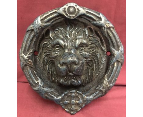 A large cast iron Lions head door knocker.  Approx. 21.5cm diameter.