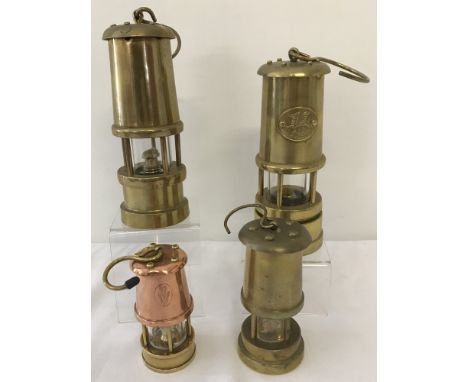 4 small vintage brass collectable miners lamps. To include one with a copper finish and one with a welsh dragon name plate an