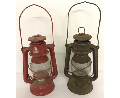 2 vintage hurricane lamps with clear glass shades, one painted red. One made in West Germany and one made in Czechoslovakia. 