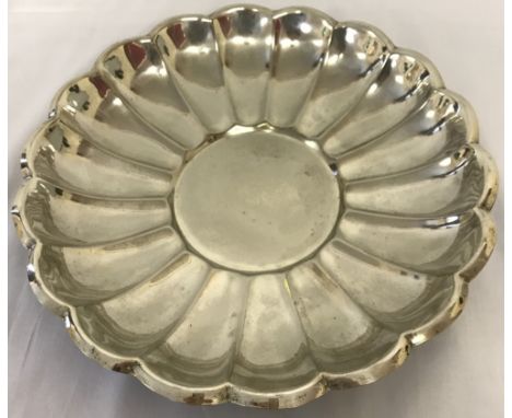A vintage silver plated dish with scalloped rim and circular centre.  Approx. 33cm diameter.