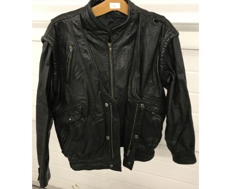 A vintage 1980's blouson style black leather men's jacket. Double zip and popper fastening, with 5 pockets to front. Size 35.