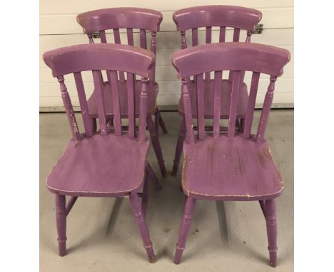 A set of 4 vintage pine slat back kitchen chairs, painted purple.  