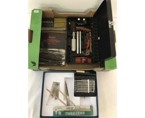 2 boxes of assorted watch making tools and equipment. To include screwdrivers, X-acto knife blades and an India oilstone. 