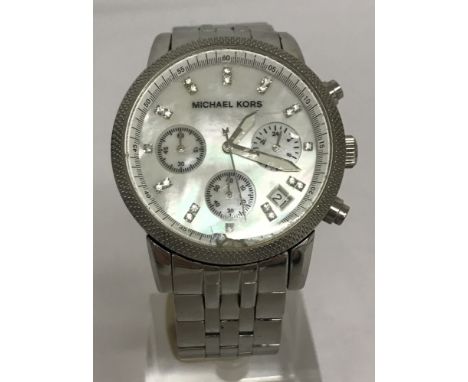 A ladies MK-5020 Michael Kors chronograph watch with mother of pearl face and stainless steel strap. Crystal set hour markers