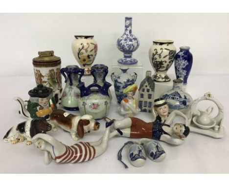 A collection of small ceramic ornaments to include Delft, Masons and Colibri table lighter.  