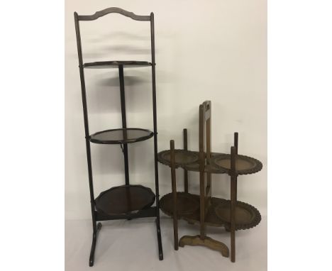Two different sized vintage cake stands. Comprising one three tier mahogany floor-standing and one table-top stand with carve