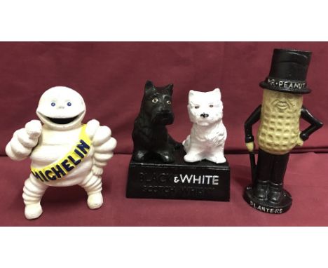 3 cast iron advertising figures/money boxes with painted detail. Mr. Peanut, Michelin and Black &amp; White Scotch Whisky. La