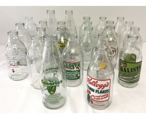 A box of 24 vintage advertising milk bottles. To include: Norwich City FC The Canaries, Dairy Crest 'Clover', Country Life, T