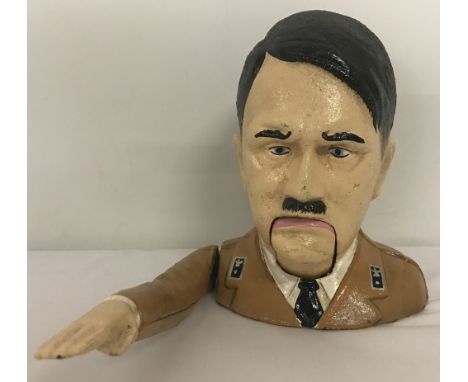 A painted cast iron Adolf Hitler nut cracker with moving arm action,  Approx. 17cm tall.