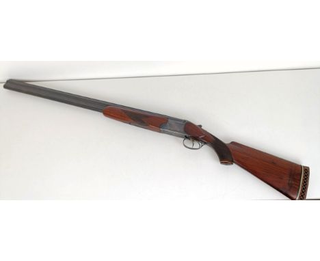 A Baikal Model IJ-12, 28 3/4 length barrel, 12 bore over and under double barrel shotgun, stamped Made In USSR Note: This can