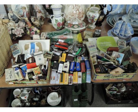 A selection of vintage tobacco and cigarette lighters packets and pen knifes