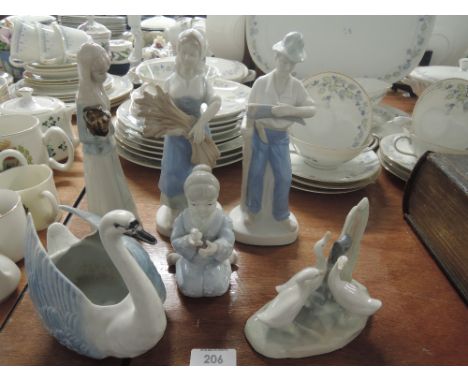 A selection of figures and figurines including Nao 