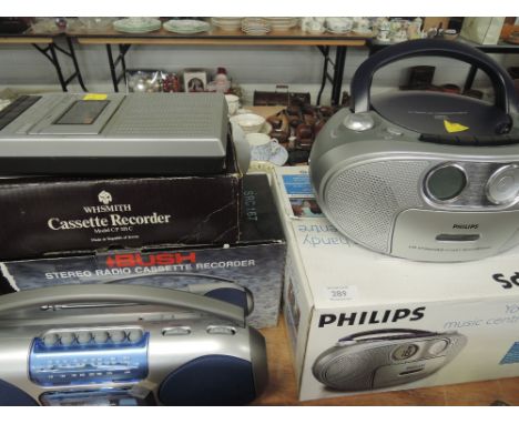 A selection of vintage and modern household audio equipment including cassette recorder