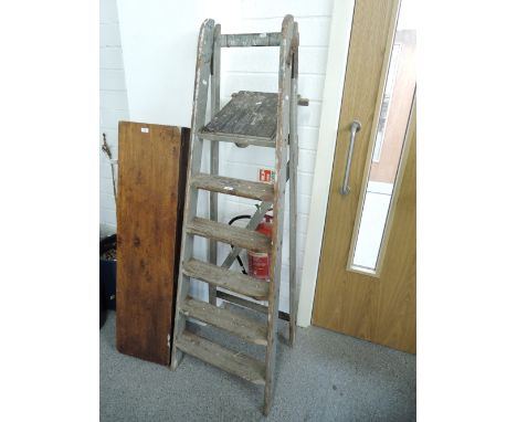 A set of vintage wooden step ladders