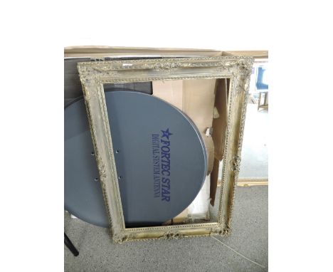 A large gilt and plaster picture of mirror frame
