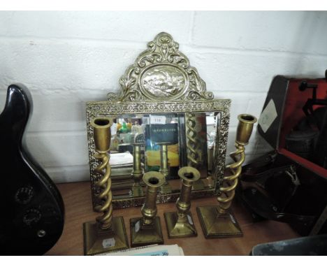 A selection of brass wares including antique candle stick pair and twisted stems