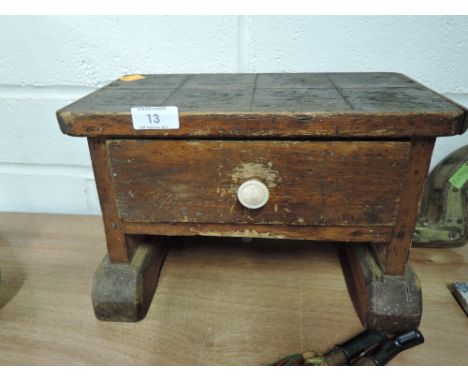 A small hand made foot stool or shelf set  with integral drawer