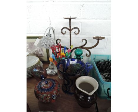 A selection of vintage decorations including wrought iron candle stick and lamp