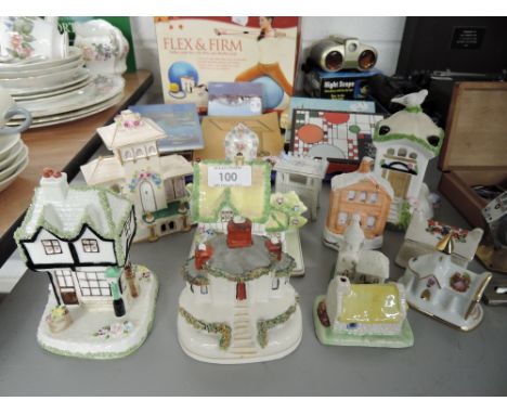A selection of miniature ceramic model houses including Coalport