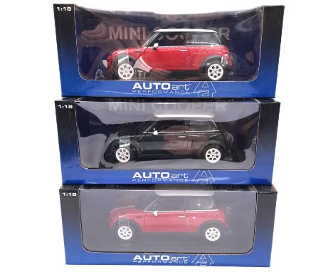 AUTOart, a boxed group of 1:18 scale Mini Cooper models comprising of 74828 BMW Mini Cooper in Red with White stripes, 78423 