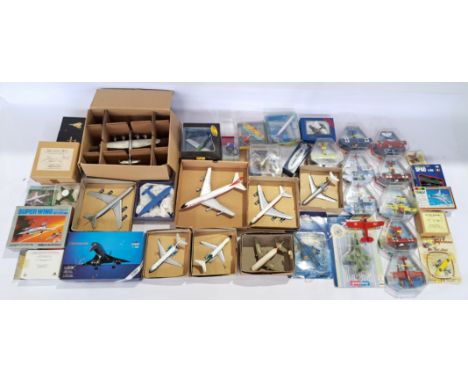 A boxed/carded/unboxed aviation group comprised of military and civilian air crafts to include; Shabak 1:250 Scale Concorde "